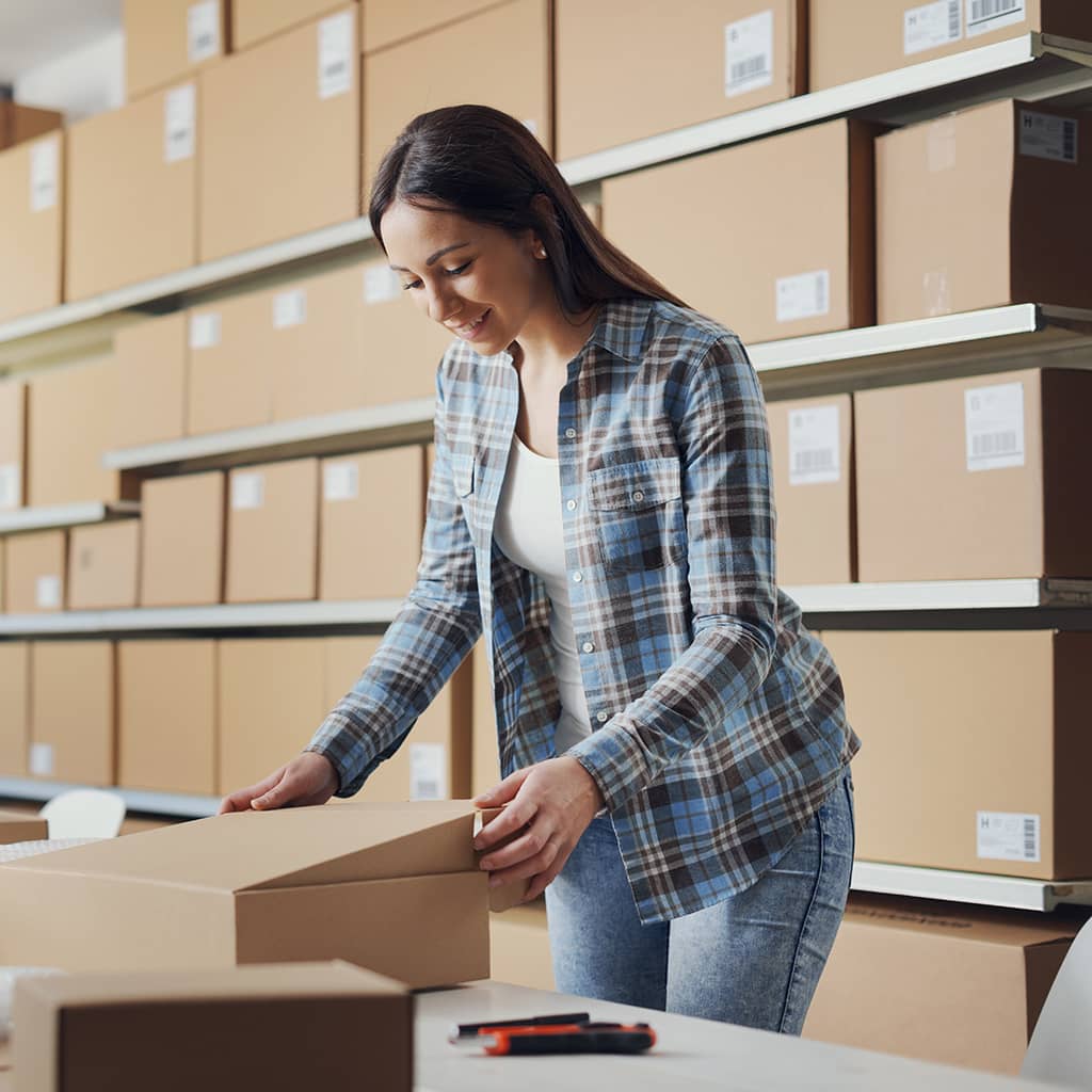 Small business owner managing products and online orders